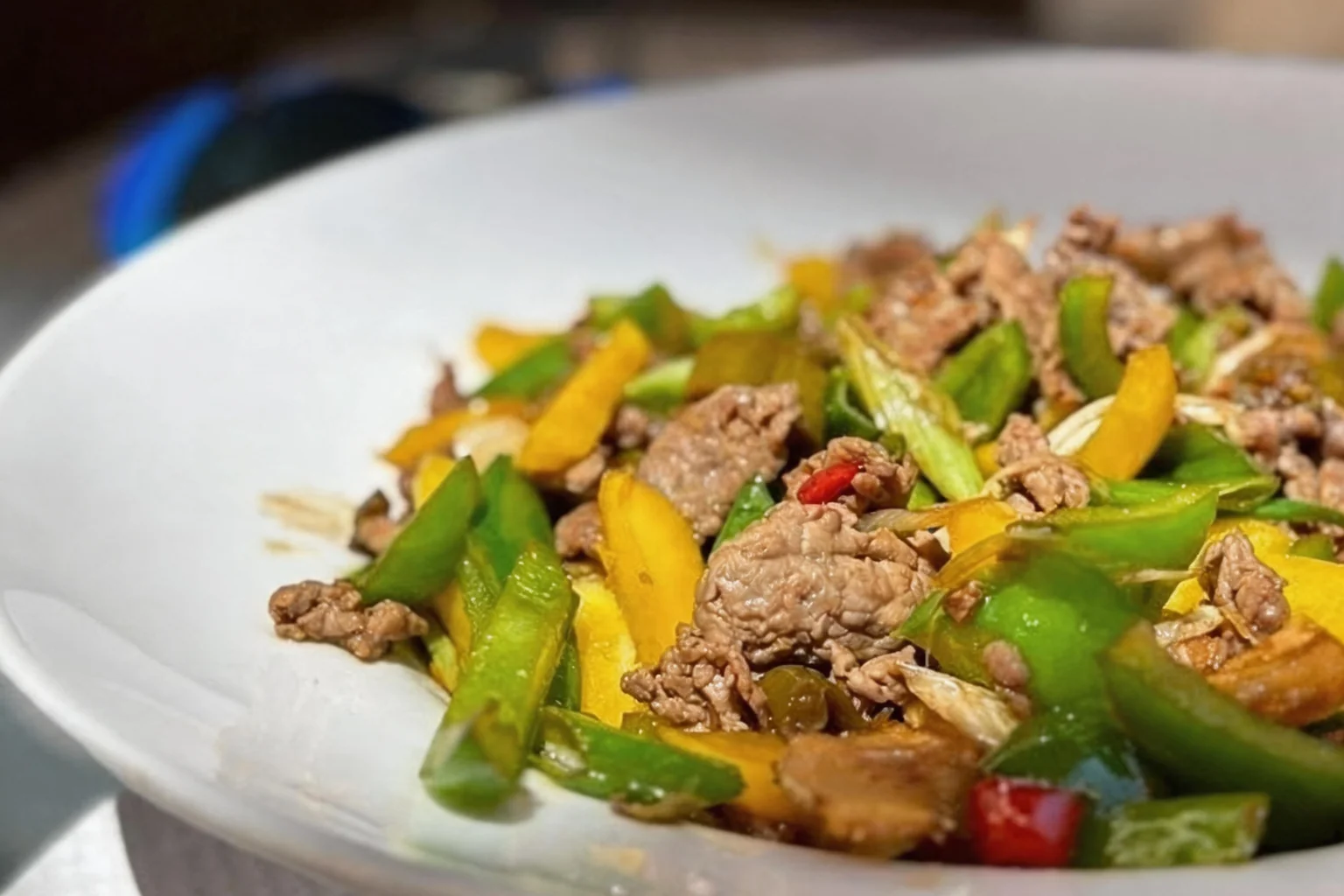 Stir-fried dish in a white deep plate